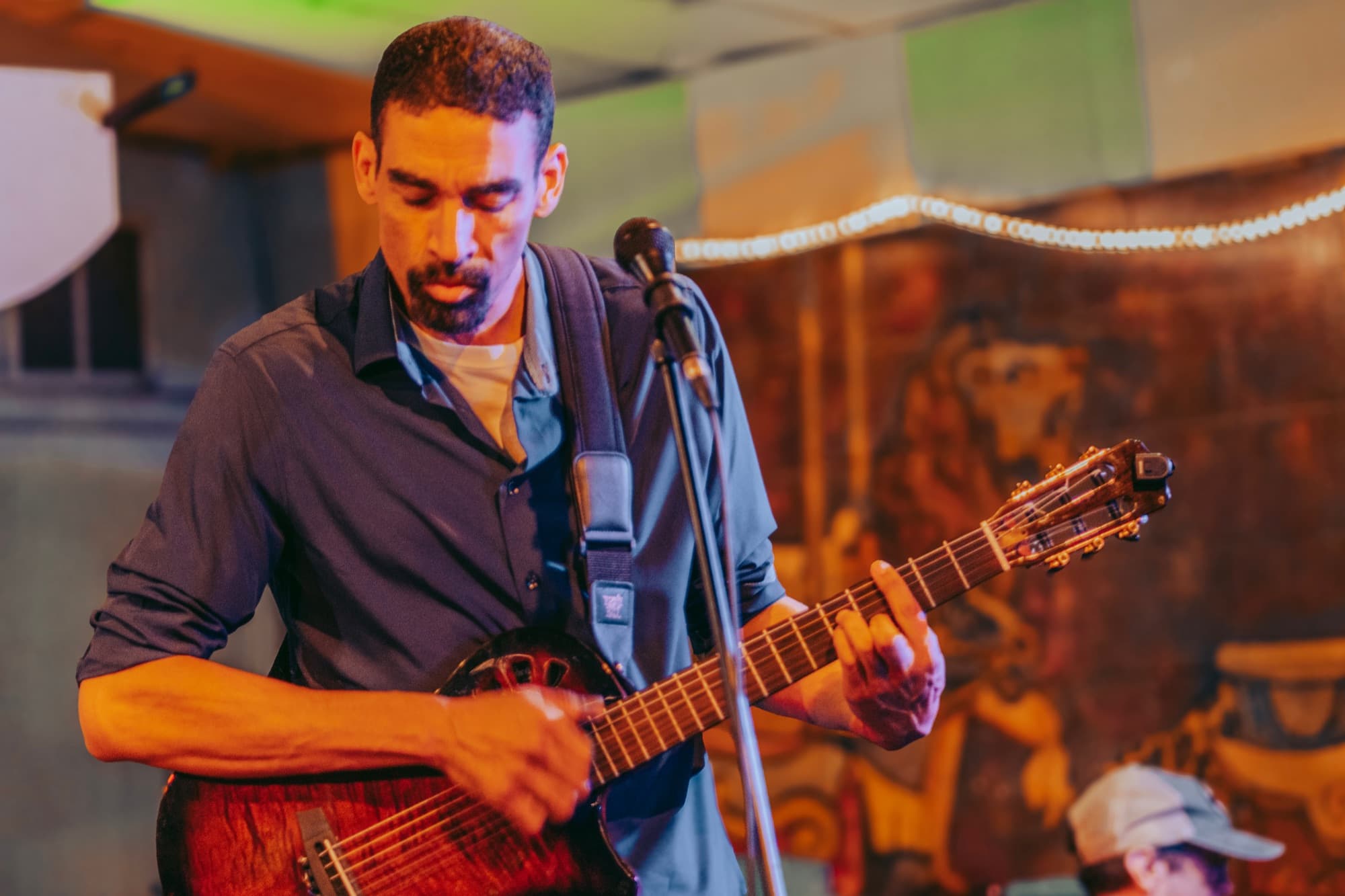 Micah Salaberrios playing guitar live